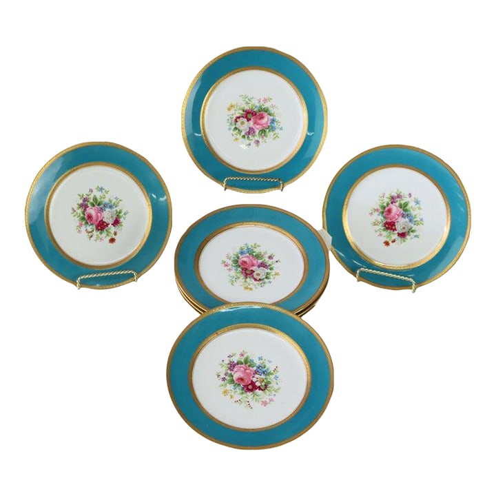 Set of 12 French Limoges Floral Decorated Porcelain Luncheon Plates C1900: A set of twelve French Limoges porcelain luncheon plates by G. Ahrenfeldt, dating to approximately 1900. Each plate features a central hand-painted floral bouquet, signed 'Mireille'. The design is fra