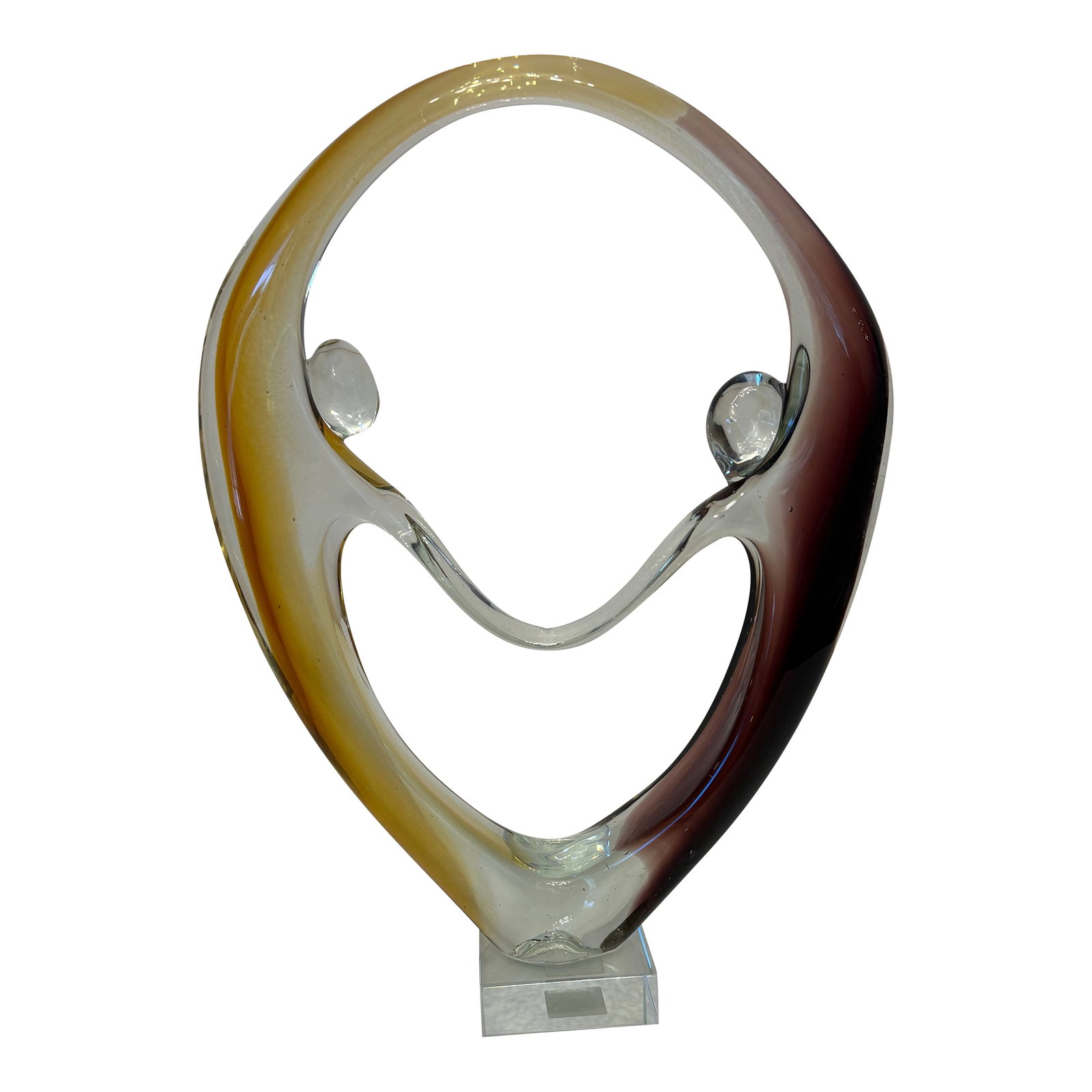 1960s Murano Style Couple Holding Hands on Pedestal: This Diamond Star Corp Murano style dancing couple sculpture featuring brown and amber glass accents. It was made in 2000's. This one stands at 11.75" high, 8.5" wide and is 2.5" deep. The colors of