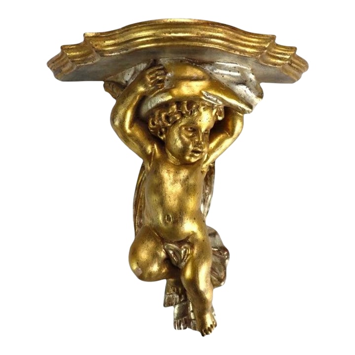 Vintage Niccolini Italia Gilt Wood Cherub Wall Sconce Signed C1950: An exquisite vintage Italian gilt wood wall sconce by Niccolini, dating to approximately 1950. This finely carved piece features a winged cherub figure, rendered in a classic style, supporting a