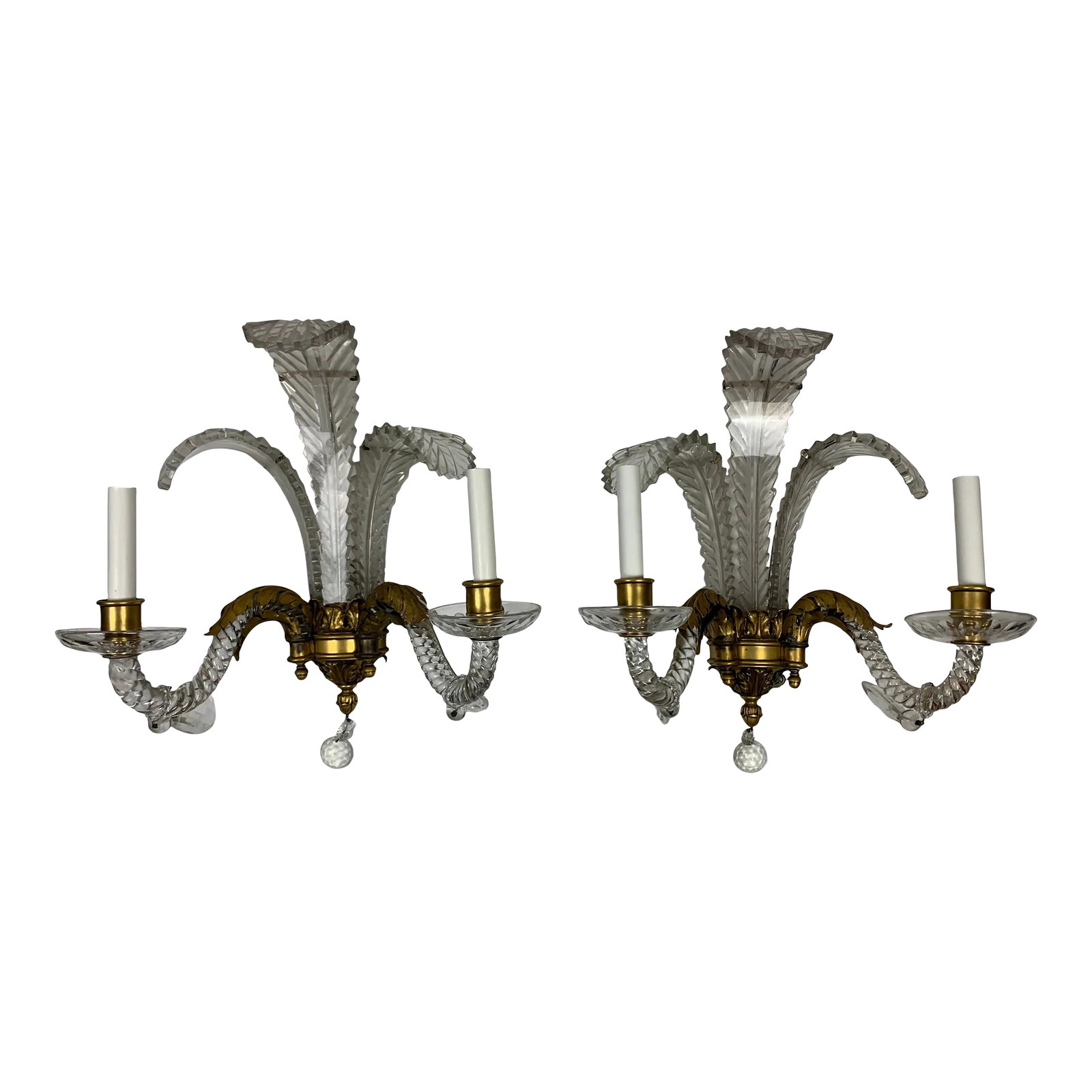 Early 20th Century French Foliate Cut Crystal and Bronze Sconces, Set of 2: Pair of French Baccarat style and bronze sconces with foliate bronze leading into crystal arms, foliate crystal shades, and highlighted with cut crystal prisms, circa 1915. Sight differences to arms