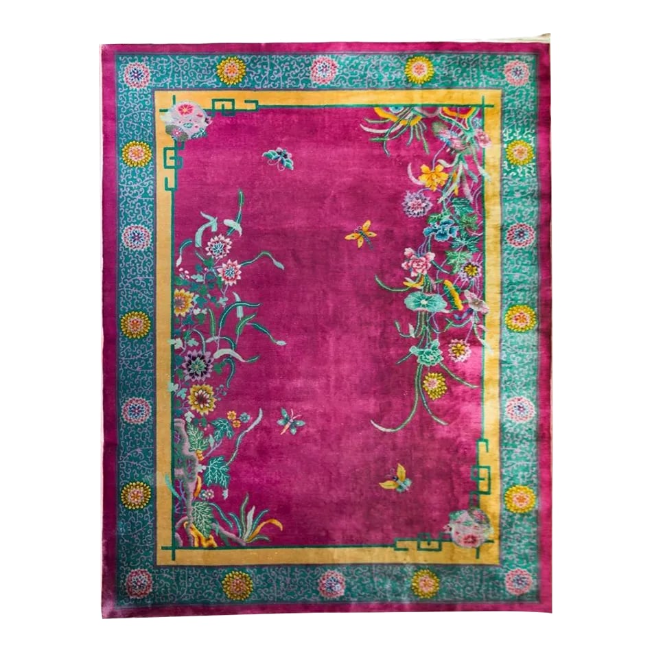 Early 20th Century Chinese Art Deco Rug: A beautiful early 20th century Chinese Art Deco rug with a brilliant fuchsia field surrounded by a border with large-scale chrystanthemum flowers amidst a tightly woven scrolling vine patterned