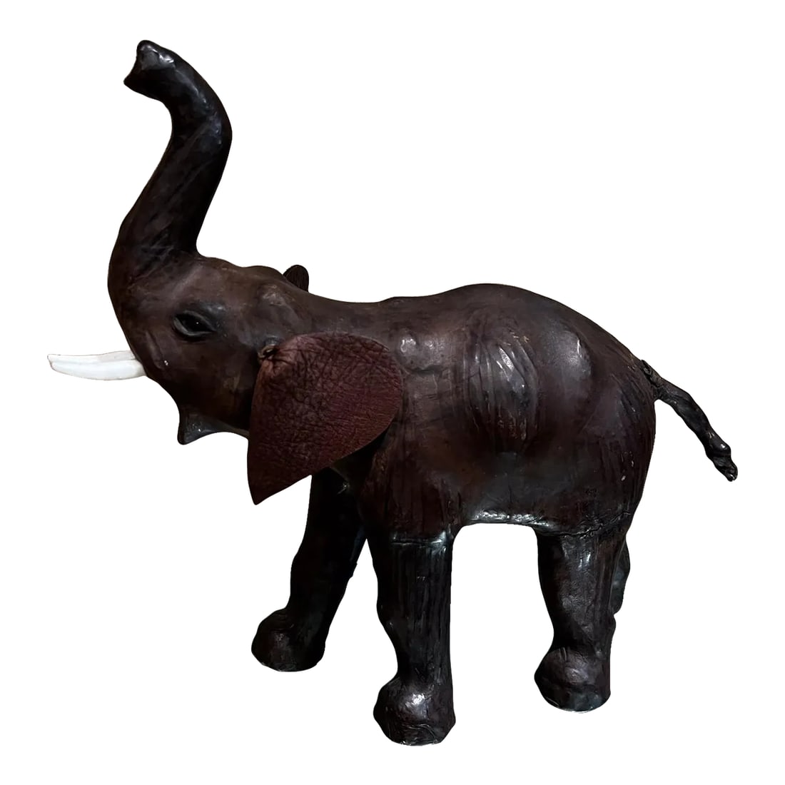 Mid-Century Modern Leather Elephant Table Sculpture, 1960s Style: For your consideration, a 1960s Mid-Century modern leather elephant table sculpture.I Wrapped chocolate brown genuine leather over a solid, molded rigid form. Inlaid glass eyes and smooth, light-color