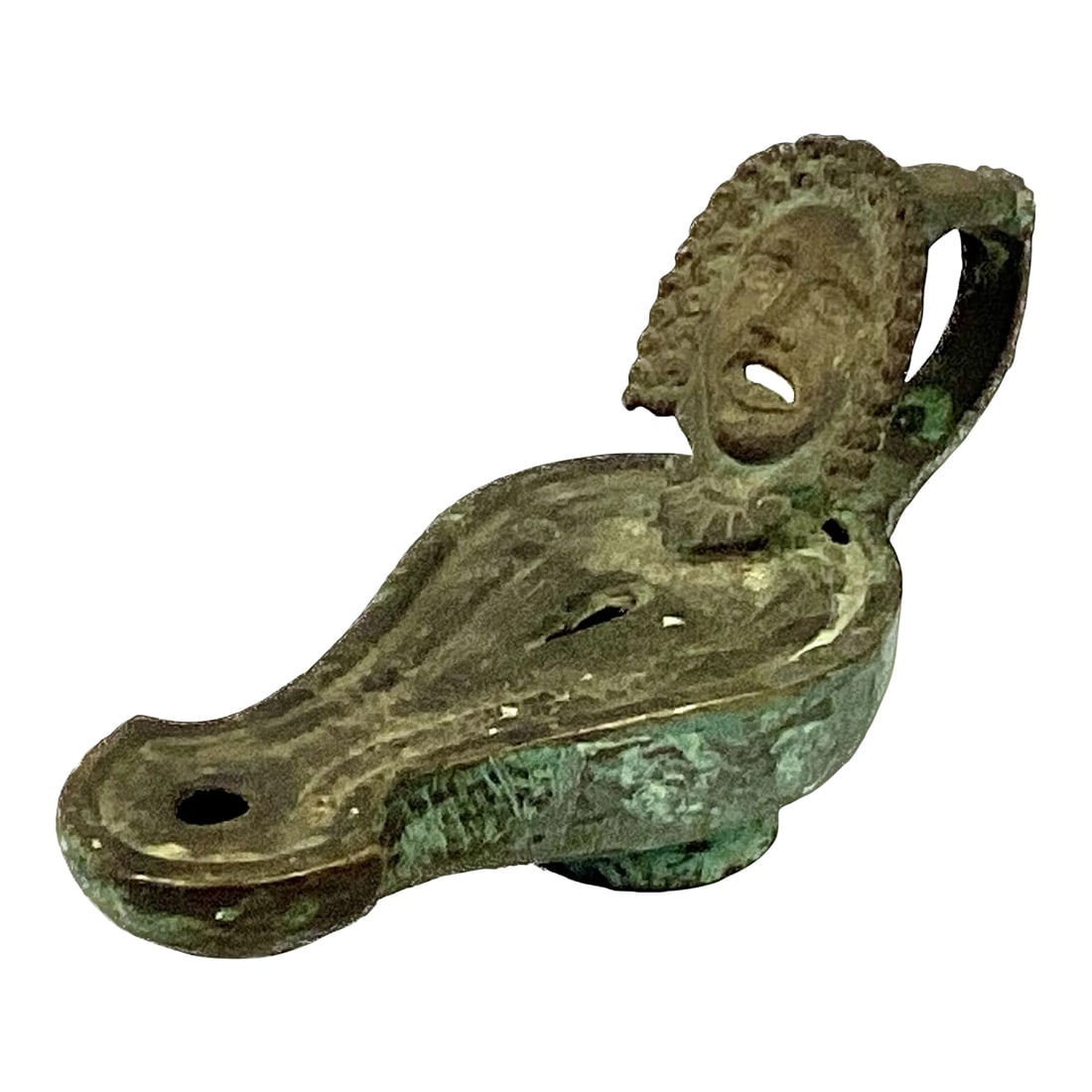 Roman Bronze Oil Lamp With Theatrical Mask Handle: A rare Roman cast bronze oil lamp with a pear-shaped body leading to a curvaceous spout. Handle has a theatrical mask with expressive facial features and tight curly hair. Oil lamps were filled with