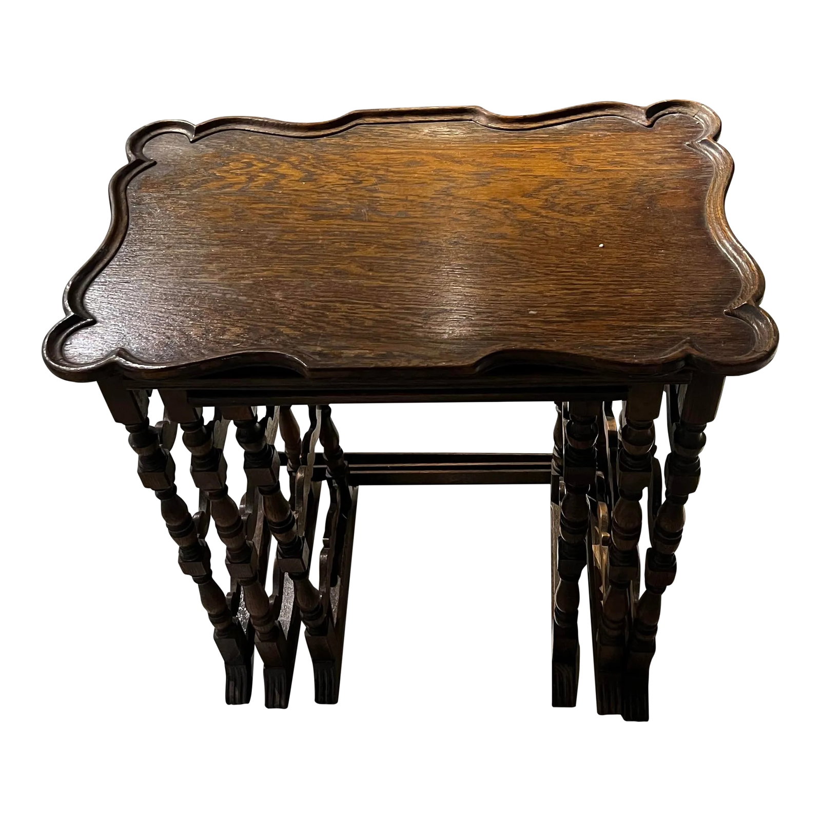 Antique Hand Carved Sold Hardwood Nesting Table a Set of #: Unique nesting tables that fit gracefully together and can also be space apart. the lower stretchers are hand carved with a Spanish Mission/ Jacobean design. The tables are stunning and very hard to
