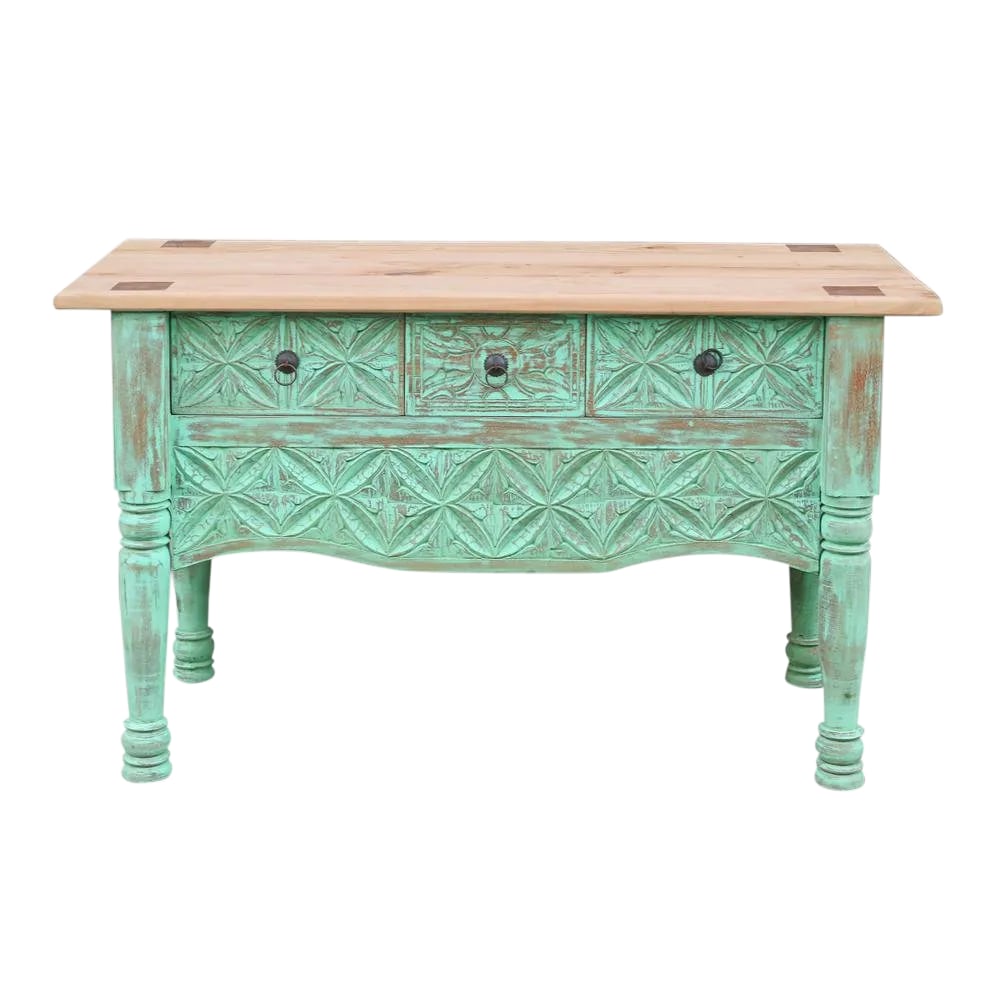 1950s Mint Green Moorish Carved Console: A charming two tone console with a natural top and green hand rubbed washed painted finish, on in its front this piece featured beautiful hand carved details and three pull out drawers. Condition: