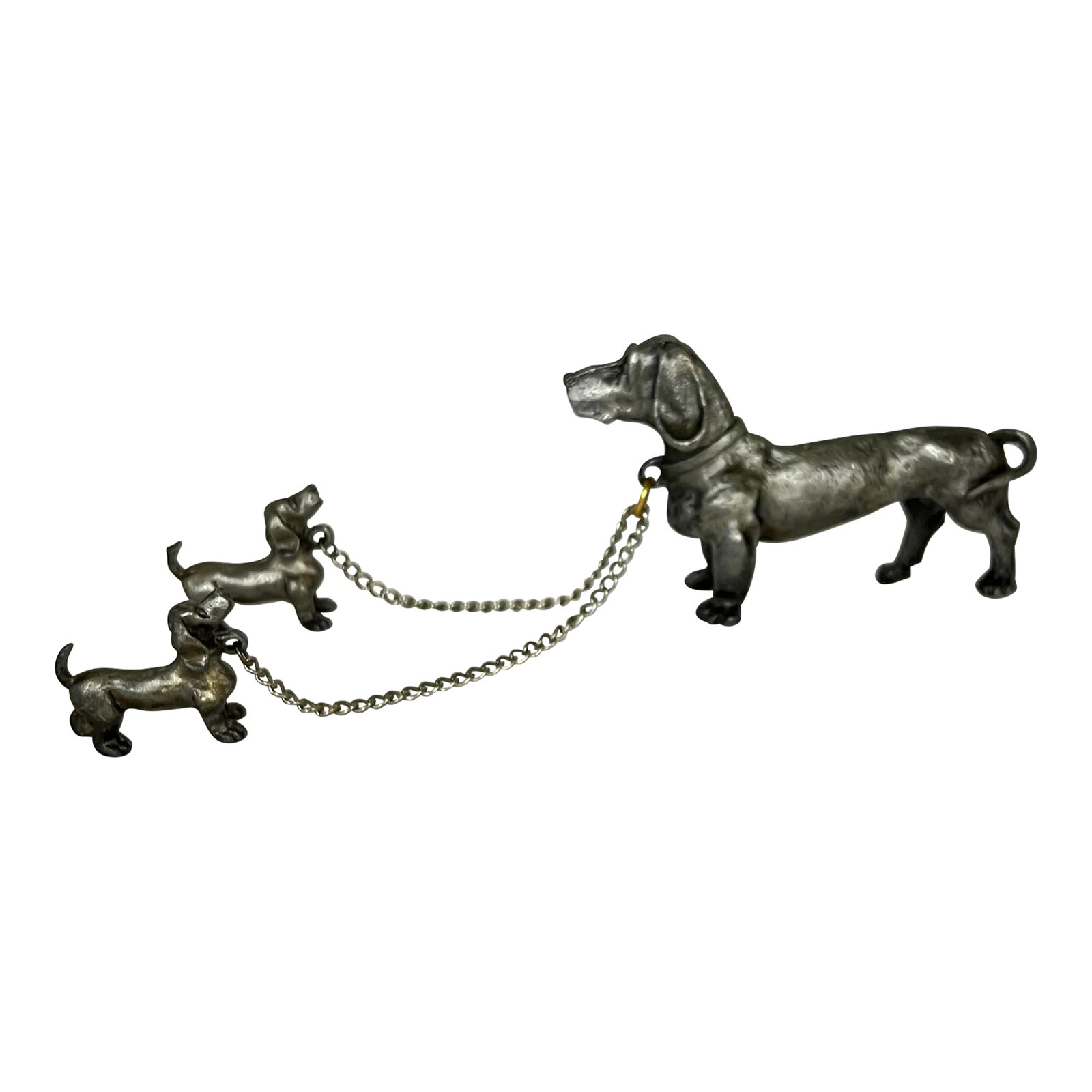 Pewter Adult Dachshund and Two Pups on Lead - Set of 3: Pewter figurine of adult Dachshund and two pups on lead. Measurements are as follows; Adult, 4" w x 2.5" h., pups, 1.5" w x 1" h. Condition: Alterations: Original Condition Unaltered Imperfections: