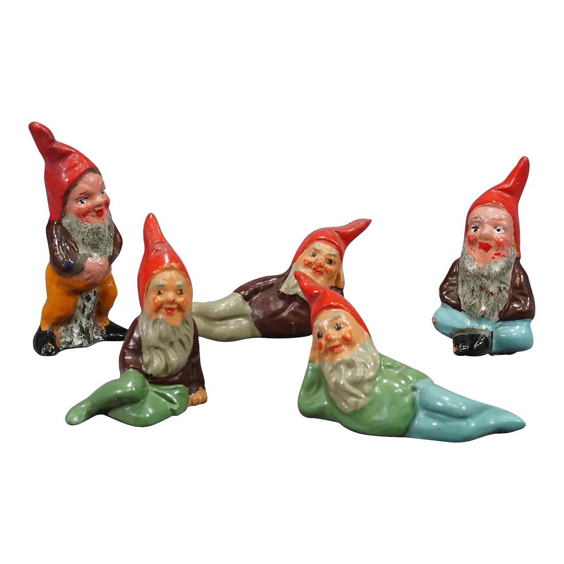 Five Tiny Terracotta Garden Gnomes, Germany Ca. 1950s: Five Tiny Terracotta Garden Gnomes, Germany ca. 1950s A whimsy set of five tiny garden gnomes made in Germany ca. 1950s probably by Heissner. They are made of terracotta and hand-painted with bright