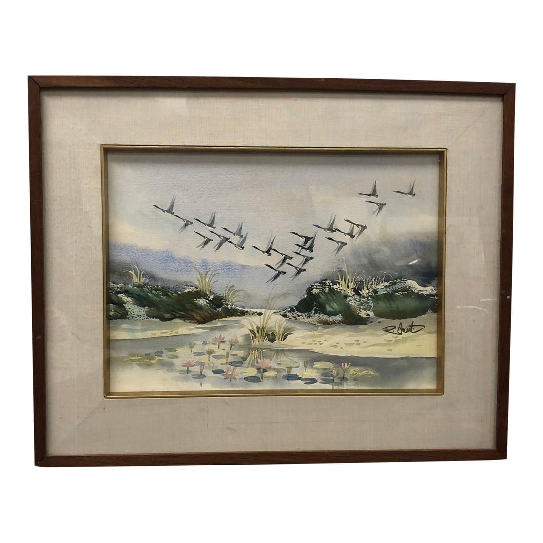 Echoes in the Sky - Mid 20th Century Original Watercolor Signed, Framed: This serene original watercolor painting captures a quiet moment in nature with a flock of birds soaring gracefully across a subdued sky. The style leans toward impressionistic realism, offering a