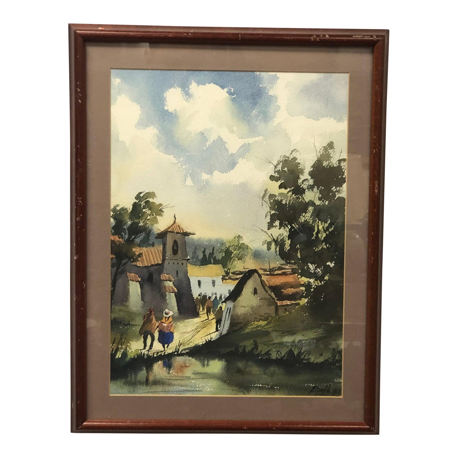 Path Through the Village - Original Watercolor Painting 1980 Signed on the Bottom, Framed: This charming 1980 original watercolor painting captures a serene village scene with warmth, nostalgia, and delicate fluidity. The artist portrays a tranquil rural setting where villagers walk along