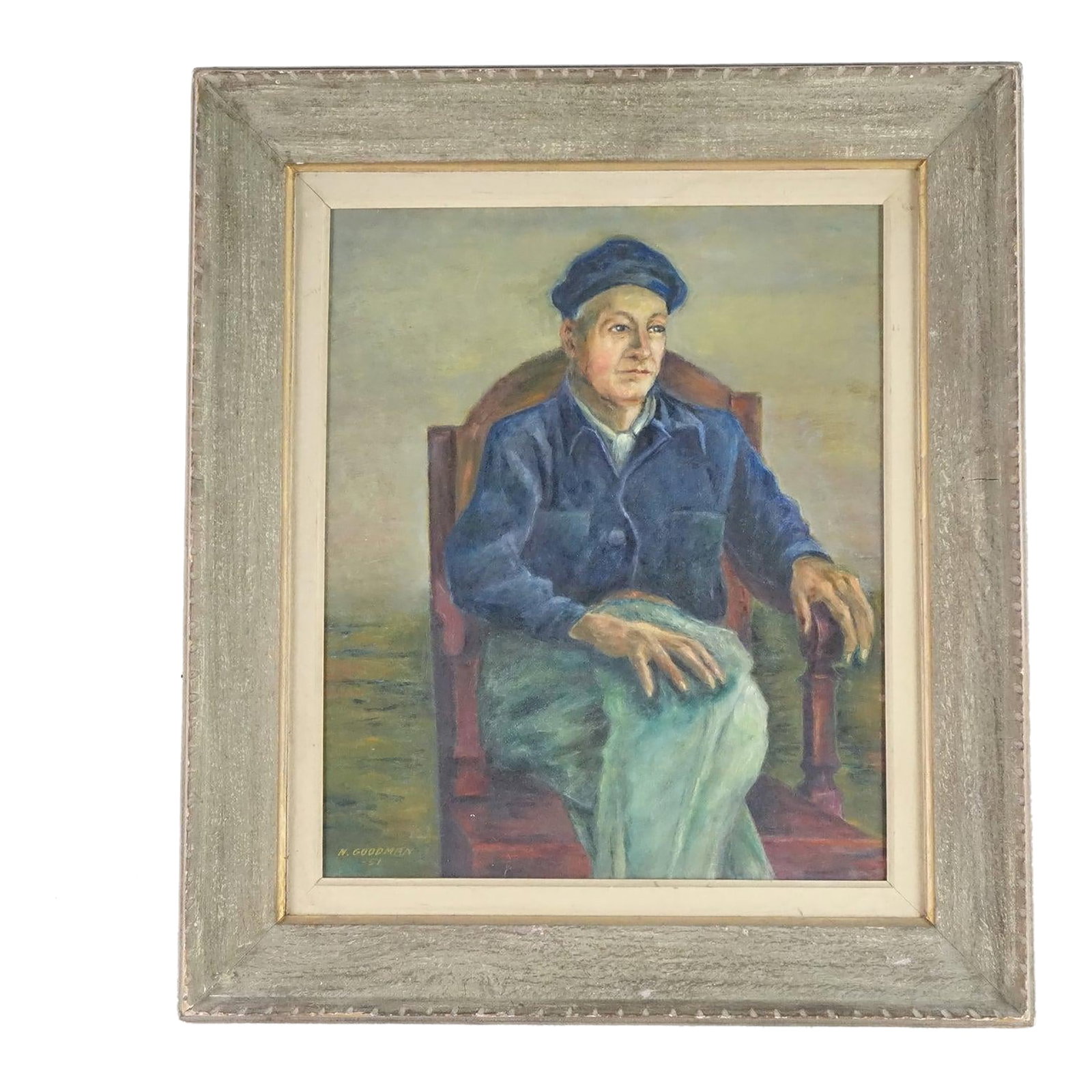 Portrait of a Working Man - Original Oil Painting by N. Goodman Signed 1951, Framed: This is a compelling mid-century oil portrait of a seated man, painted in 1951 by artist N. Goodman. The subject is a working-class man, dressed in a blue denim work shirt and cap, sitting in a