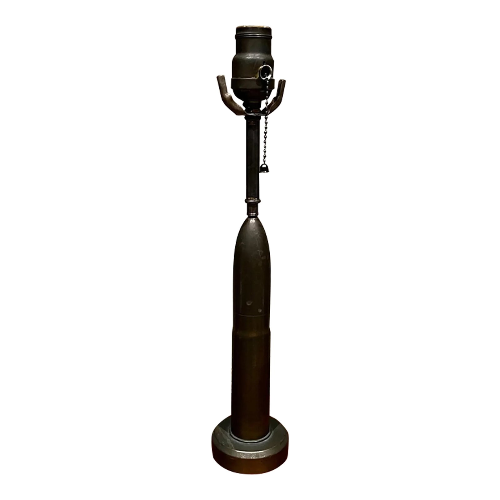 Mid-Century Modern Patinated Bronze Bullet Table Lamp, 1960s Design: For your consideration, Vintage single table lamp military bullet artillery shell designed in patinated bronze No shade is included. Dimensions: 16.5" H x 3.25" diameter Please take a look at our