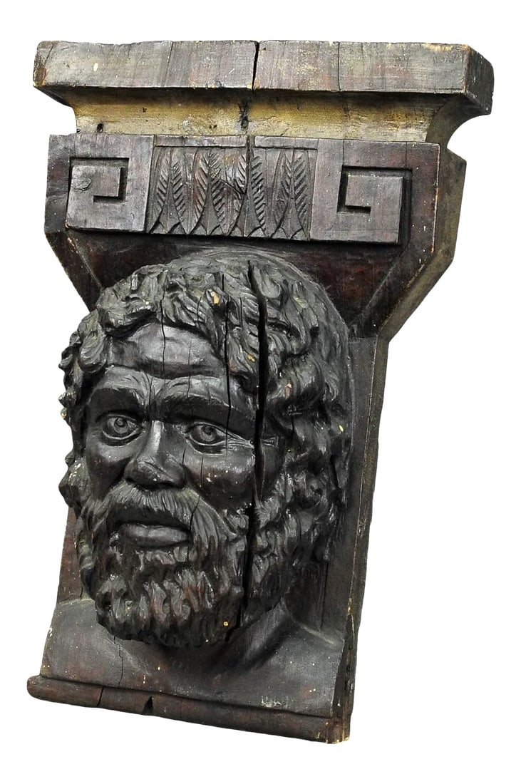 1930s Wooden Sculpture of a Masculine Face: Wooden Sculpture of a Masculine Face A highly detailed antique sculpture of a male face. It is an impressive wall decoration consisting of handcarved and stained wood. Measures: Width: 13.78" (35 cm)