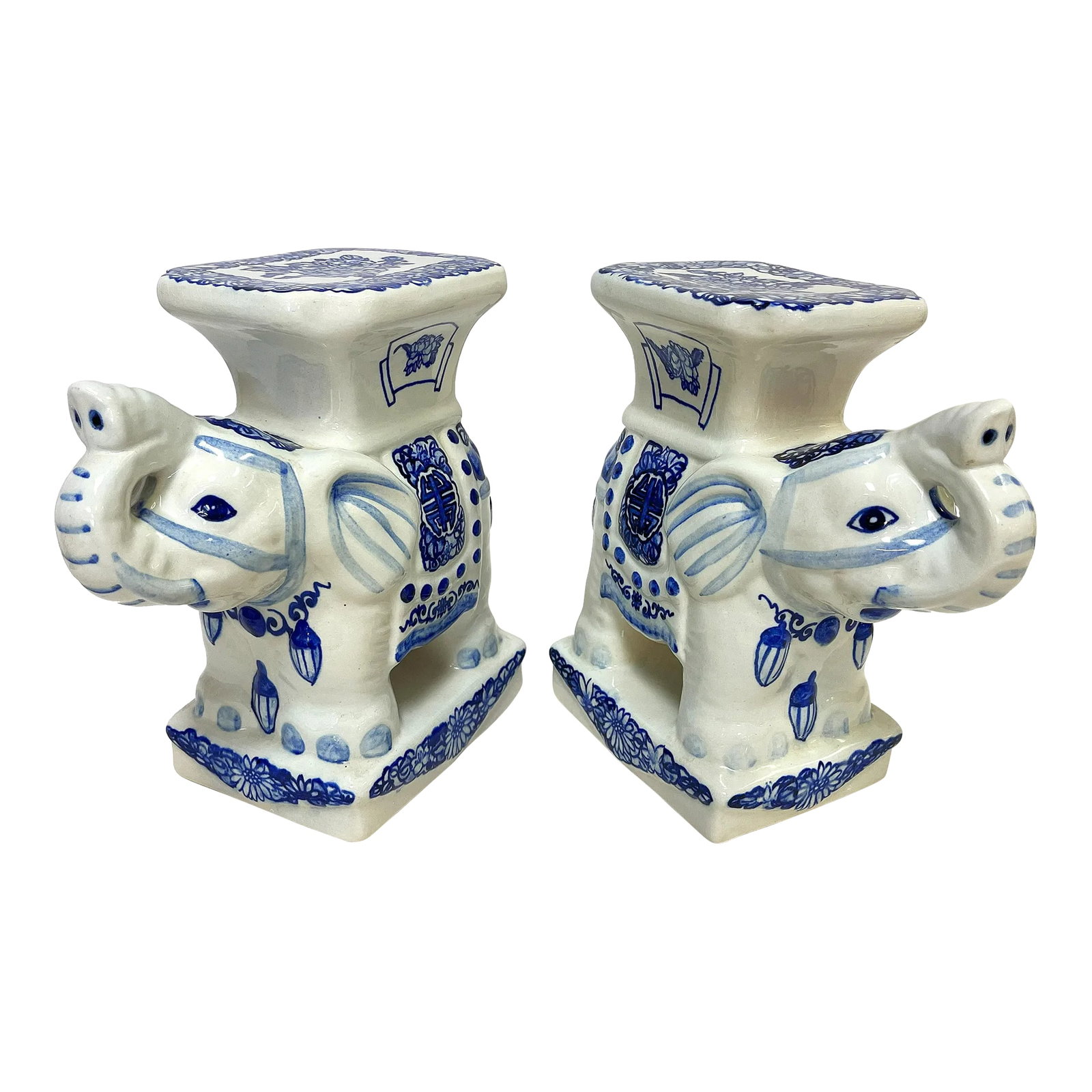 Vintage Blue and White Chinoiserie Ceramic Elephant Plant Stands- a Pair: Playful pair of ceramic elephant plant stands from the 20th century. The pair are painted in blue and white Chinoiserie style designs. They are not marked. The petite pair would look great on their