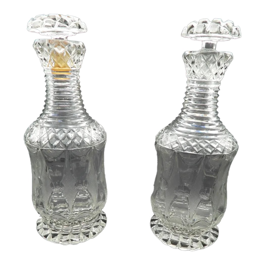 Antique 19th Century Georgian Diamond Cut Glass Wine Spirits Decanters- Set of 2: This marvelous pair of 2 19th Century Georgian style cut glass wine or spirits decanters are created with a very beautiful diamond cut pattern, as well as a ribbed neck and a delightful ribbon,