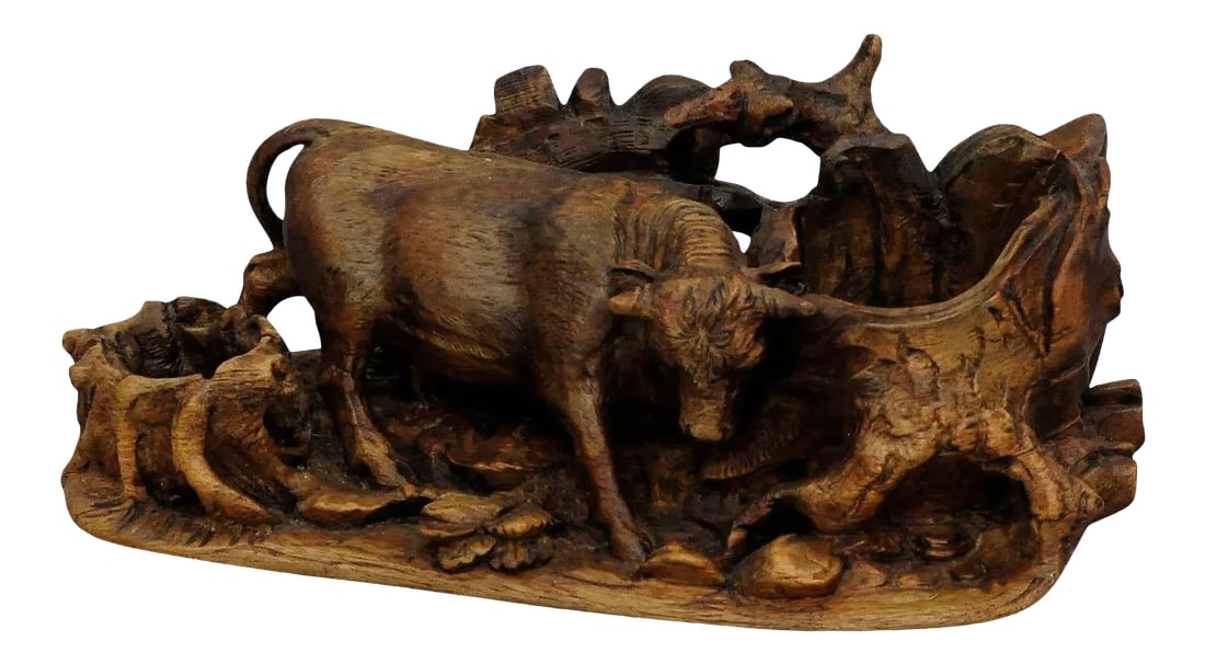 Late 19th Century Carved Statue of a Bull Ca. 1900: Finely Carved Statue of a Bull ca. 1900 The antique Black Forest carving of a bull which is chafing on a tree stump. It was made most probably in Brienz, Switzerland ca. 1900. The tradition of wood