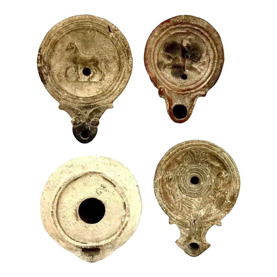 Roman Terracotta Oil Lamps, Set of Four: Roman Terracotta Oil Lamps, Set of Four, used as an alternative to candles, dating back to 2nd century A.D. These small and compact oil lamps commonly used olive oil as fuel, and had a wick placed in
