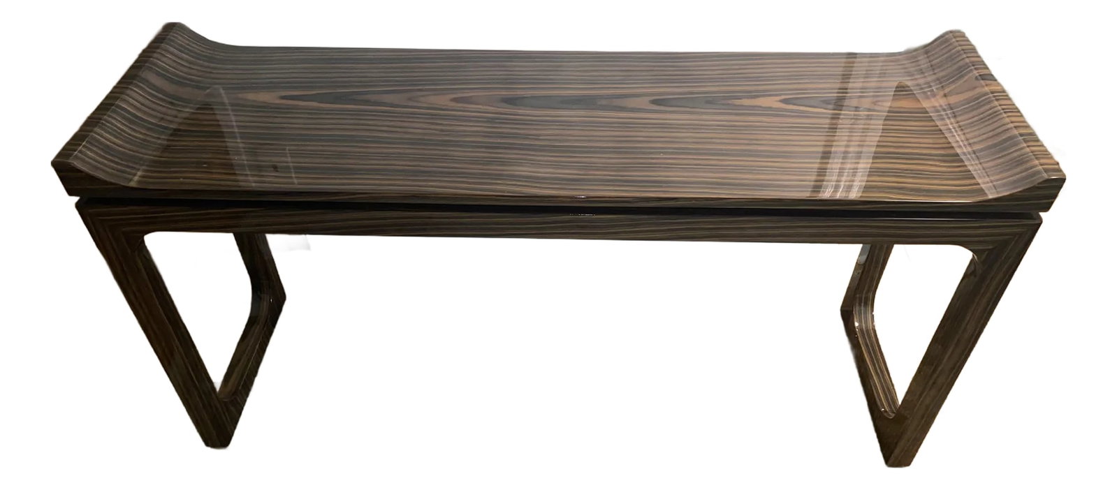 Art Deco Macassar Veneer Lacquered Console: Eye catching sleek lacquered art deco style console having gorgeously grained Macassar veneer. Each end curves sensually upward and the legs at each end are connected to oneanother by a stretcher.