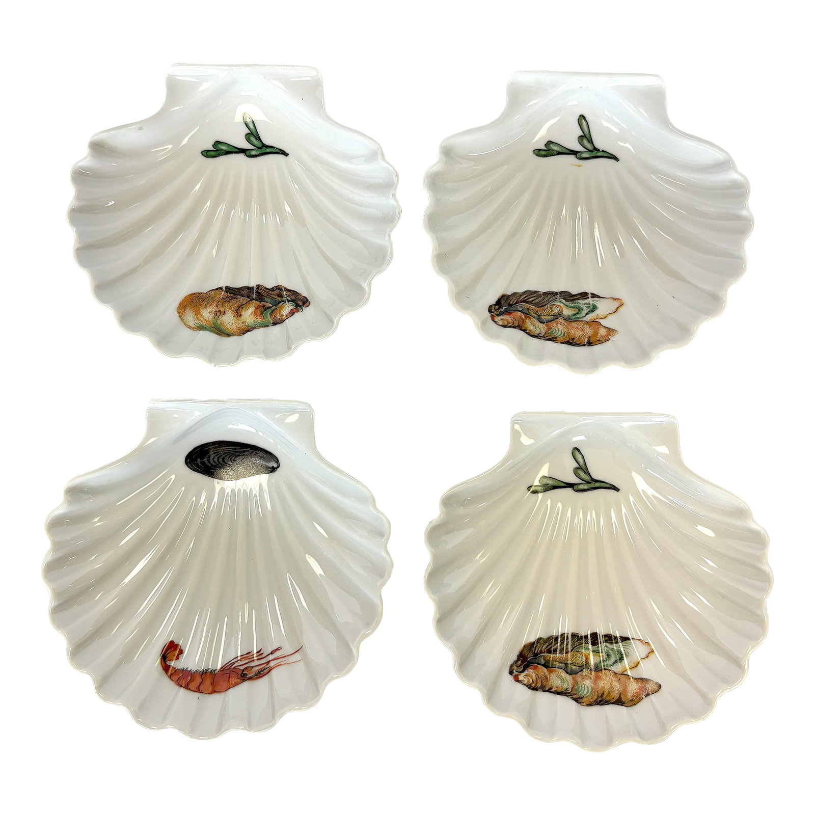 Vintage French Porcelain Clam Shell Dishes- Set of 4: Great set of four vintage porcelain dishes made in France. Each has a large clam shell shape and are decorated with various shellfish designs. Each of the four plates is slightly different. They are
