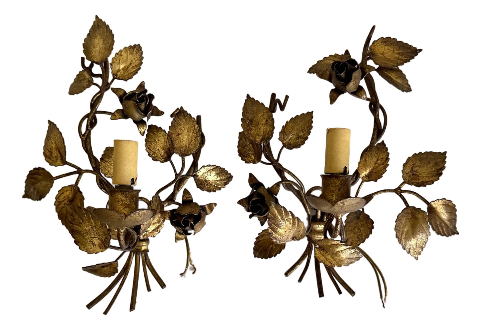 1950s Pair of Italian Florentine Hollywood Regency Gilt Metal Rose Wall Sconces: This lovely pair of Hollywood Regency inspired vintage Italian Florentine gilt metal rose wall sconces dates to the mid-20th century. These ornate toleware pieces feature dimensional floral designs