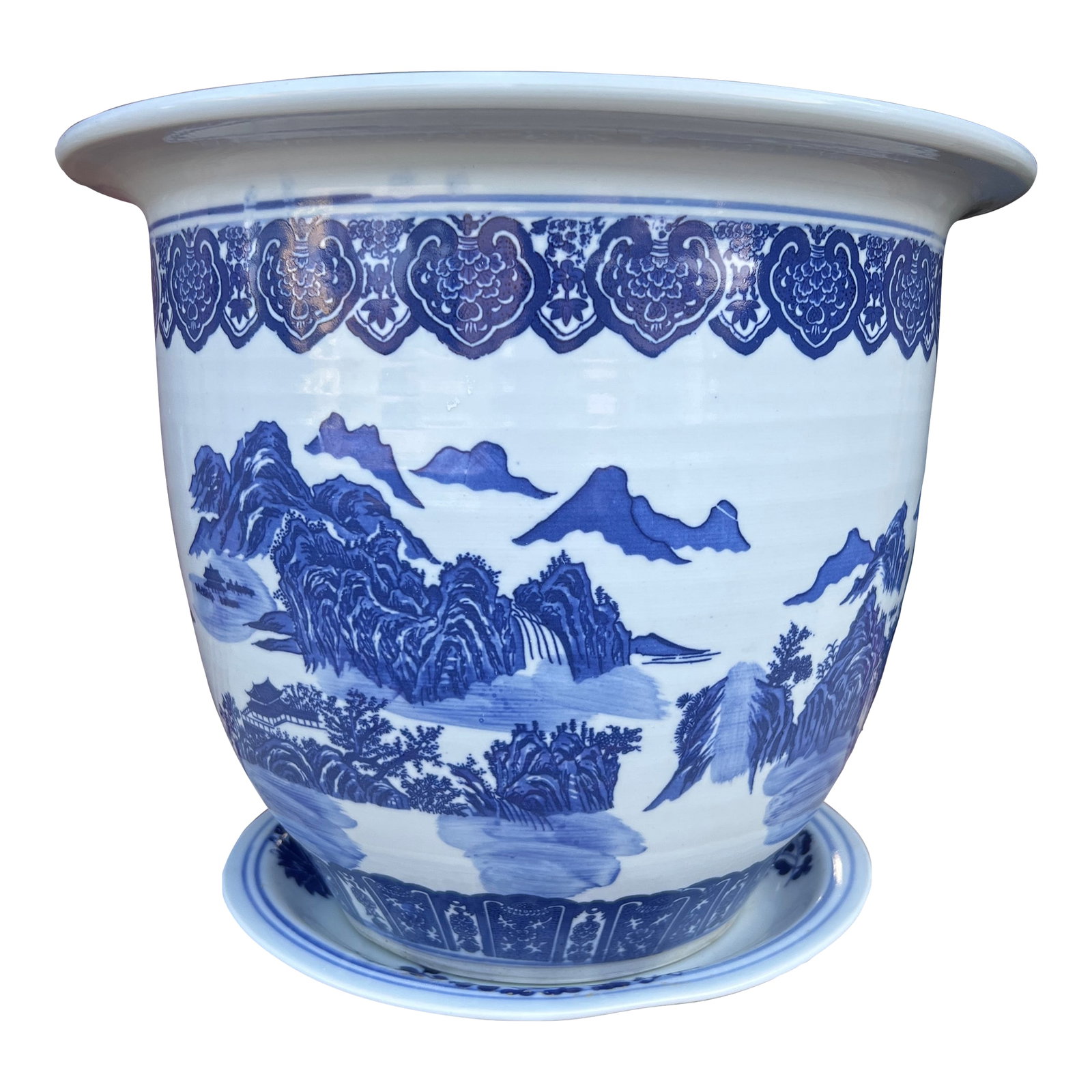 Vintage Chinese Blue and White Porcelain Jardiniere With Underliner: Vintage Chinese Blue and White Porcelain Jardiniere With Underliner Nice shaped jardiniere, with a blue decorated underliner. Mountains and clouds scenery on the sides. Hole drilled in the bottom for