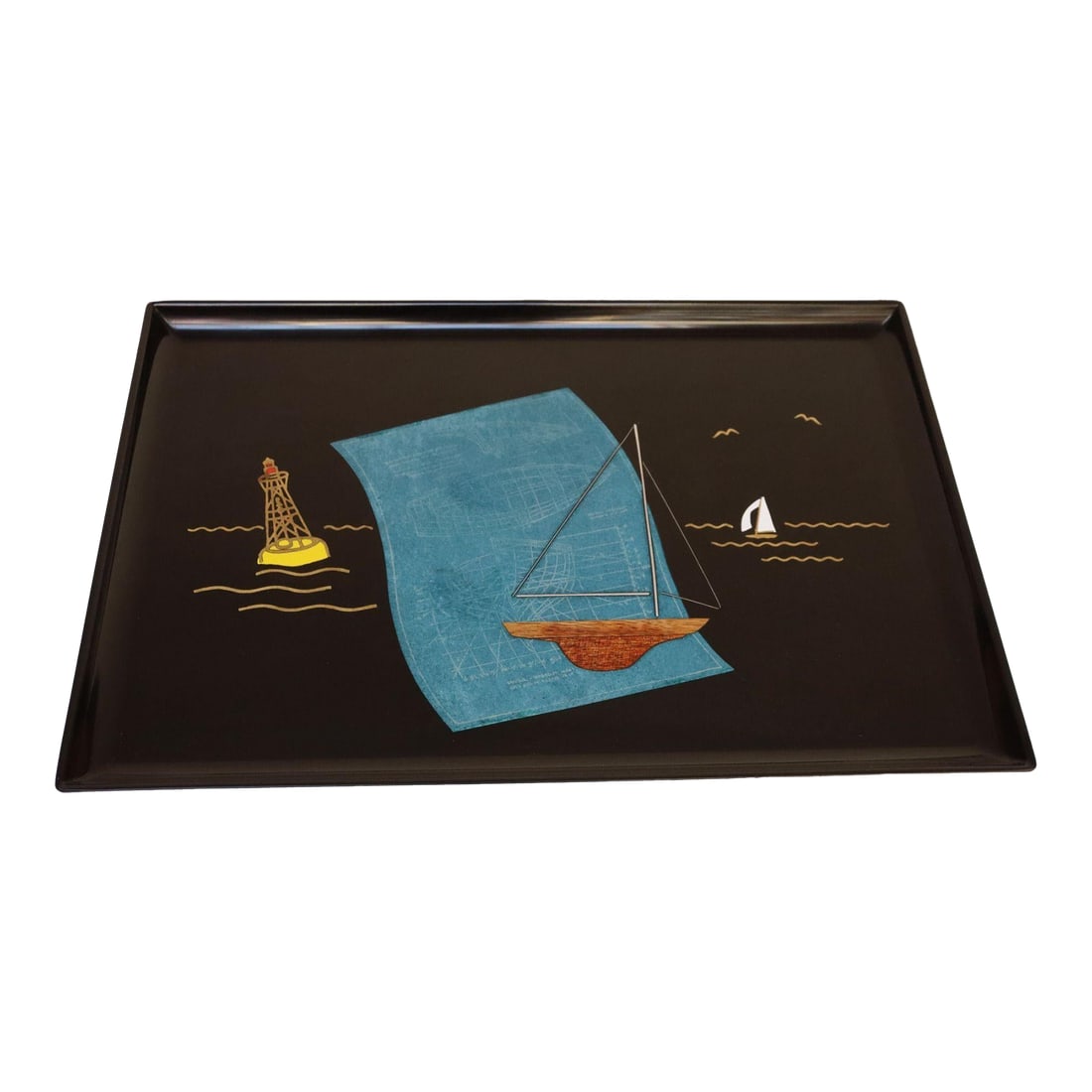 Large Mid-Century Black Resin Tray With Inlaid Sailboats and Lighthouse Motif: Large, rectangular tray by Couroc of Monterey, California with an inlaid sailboat and lighthouse design (circa 1960s). Composed of a black lacquer phenolic resin (water, burn, stain, and detergent