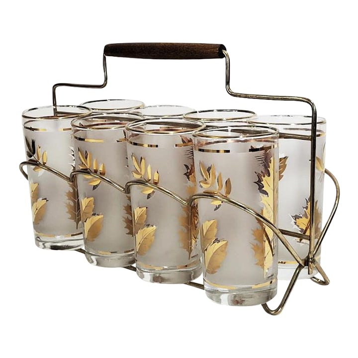 Mid-Century Modern Libbey Golden Foliage Glasses With Caddy - Set of 8: Set of 8 MCM Libbey Glass Co. tumblers in the Golden Foliage pattern complete with wood handled caddy. This popular 60's pattern boasts 22 Karat Gold Leaf and the glasses are frosted. Excellent condit