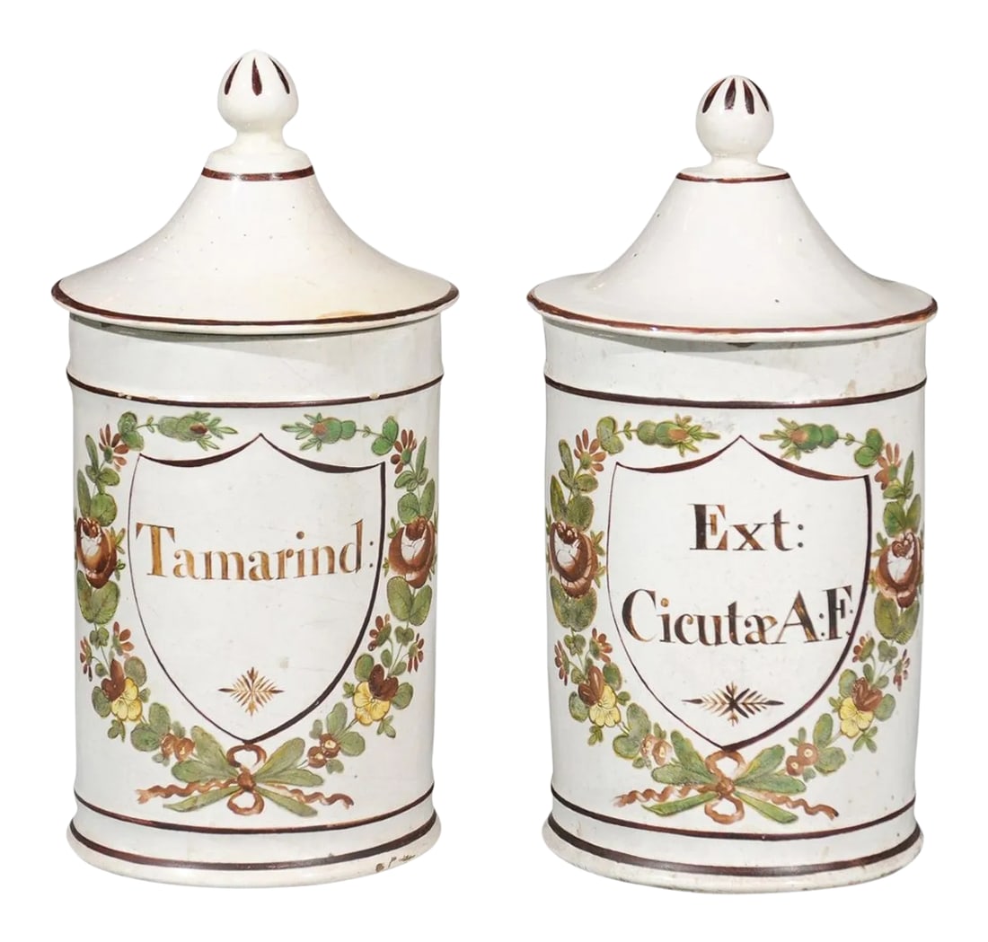 Late 18th Century French Directoire Lidded Apothecary Jars with Labels- a Pair: A pair of French Directoire period ceramic lidded apothecary jars from the late 18th century, with hand-painted foliage motifs, labeled Tamarind and Ext. CicutÃ¦ A:F, from the Deroche factor