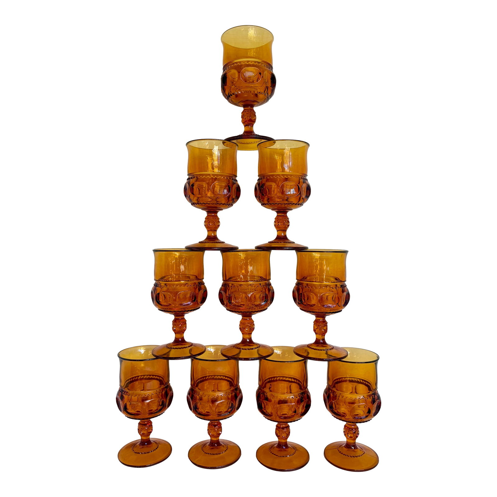 1960s Set of 10 Vintage Amber Glass Thumbprint Wine Glass Goblet Set: Here is a warm, set of TEN vintage amber goblets full of retro charm. The glasses feature the classic thumbprint pattern "” a beloved mid-century pressed glass design known for its rounded,