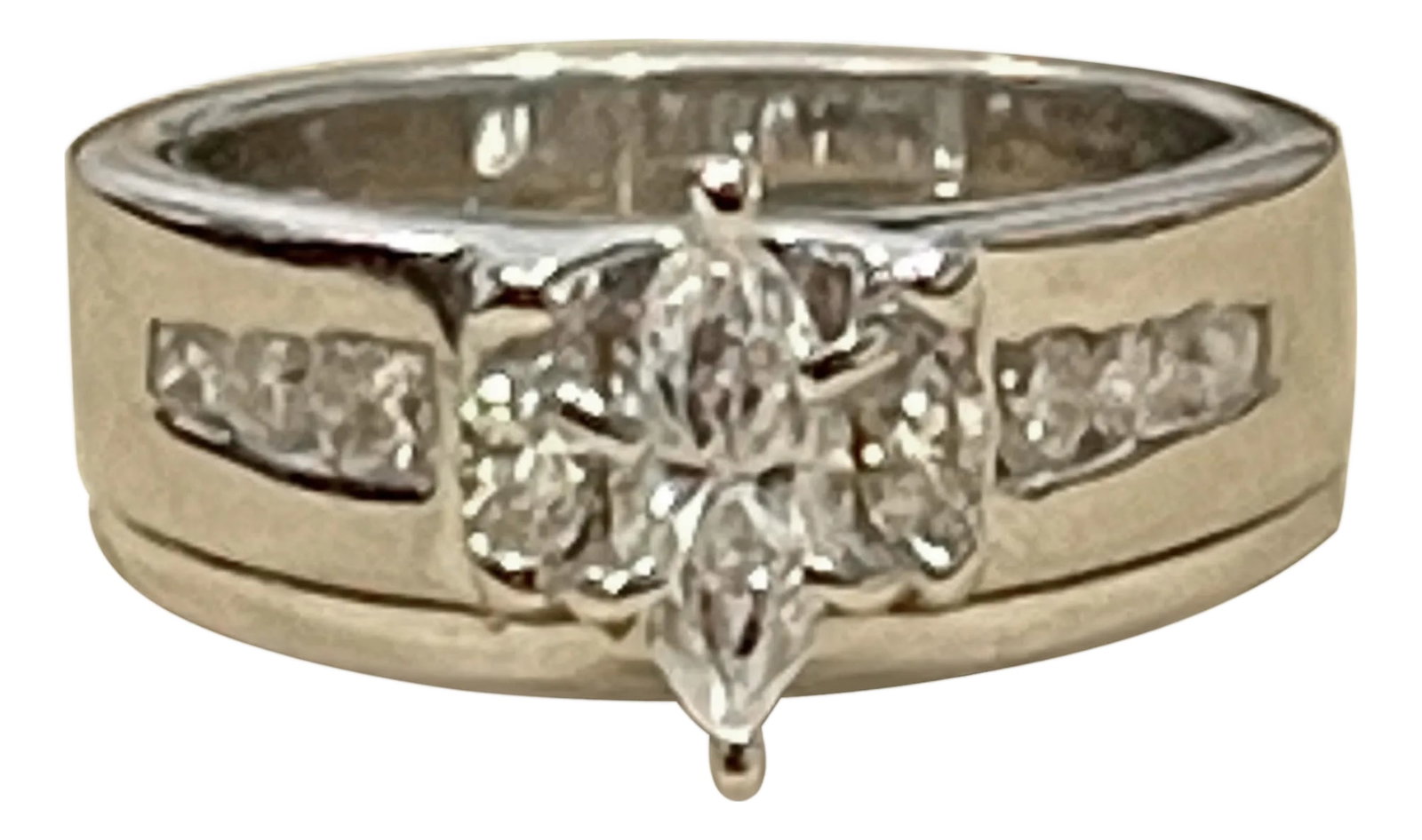 Approximately 0.75 Carat Diamond Engagement Ring/Band 14 Karat White Gold: Approximately 0.75 Carat Diamond Ring/Band 14 Karat White Gold Size 4 & 1/2 The ring design is such that it looks like it has a band with the ring Approximately 50 pointer Marquise Center diamond and