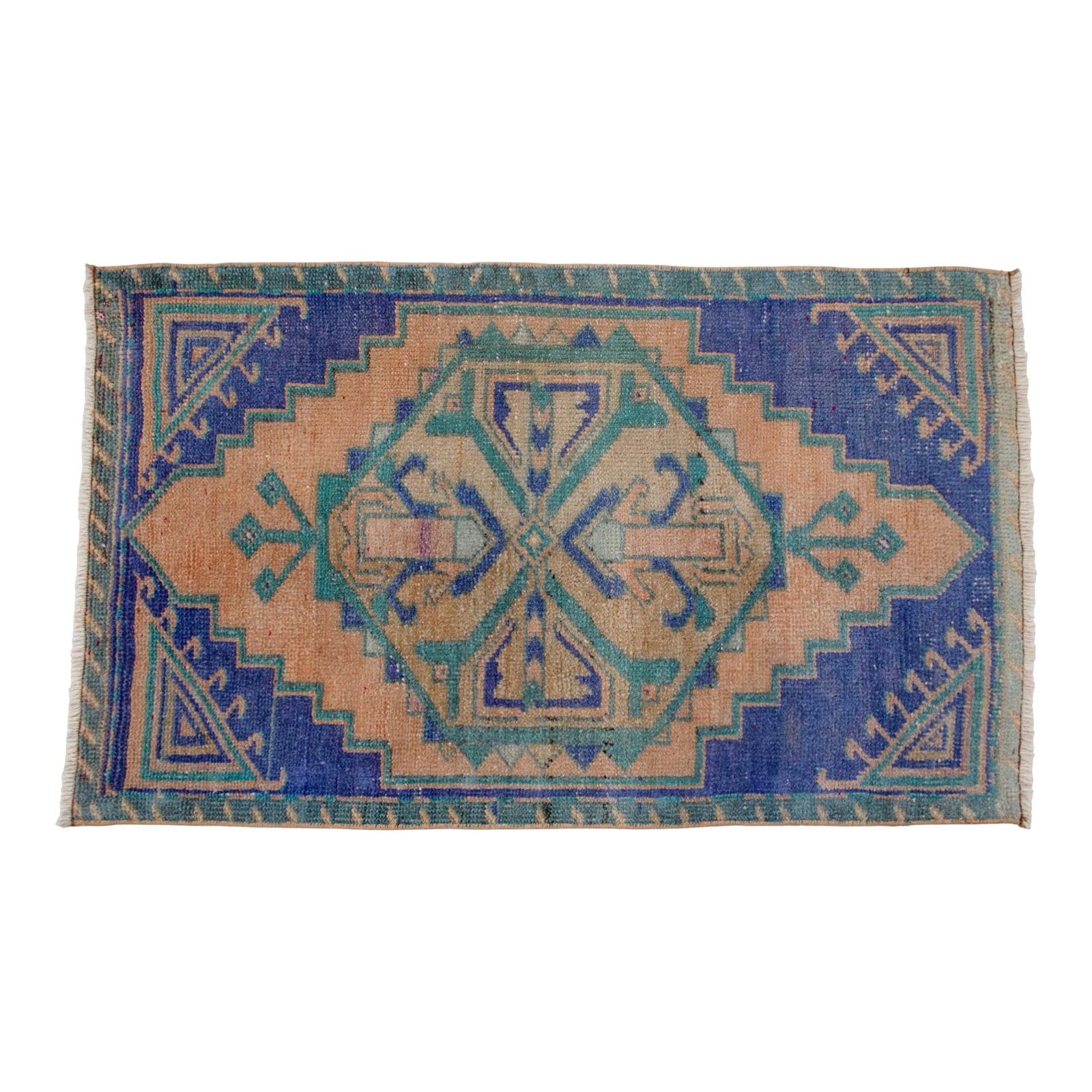 1970s Hand Knotted Small Oushak Rug Mini Rug Mat - 1'9" X 2'11": This vintage Oushak mat features a soft, sun-faded palette of dusty apricot and deep indigo, perfect for adding a touch of soulful character to smaller spaces. Its geometric medallion and stepped