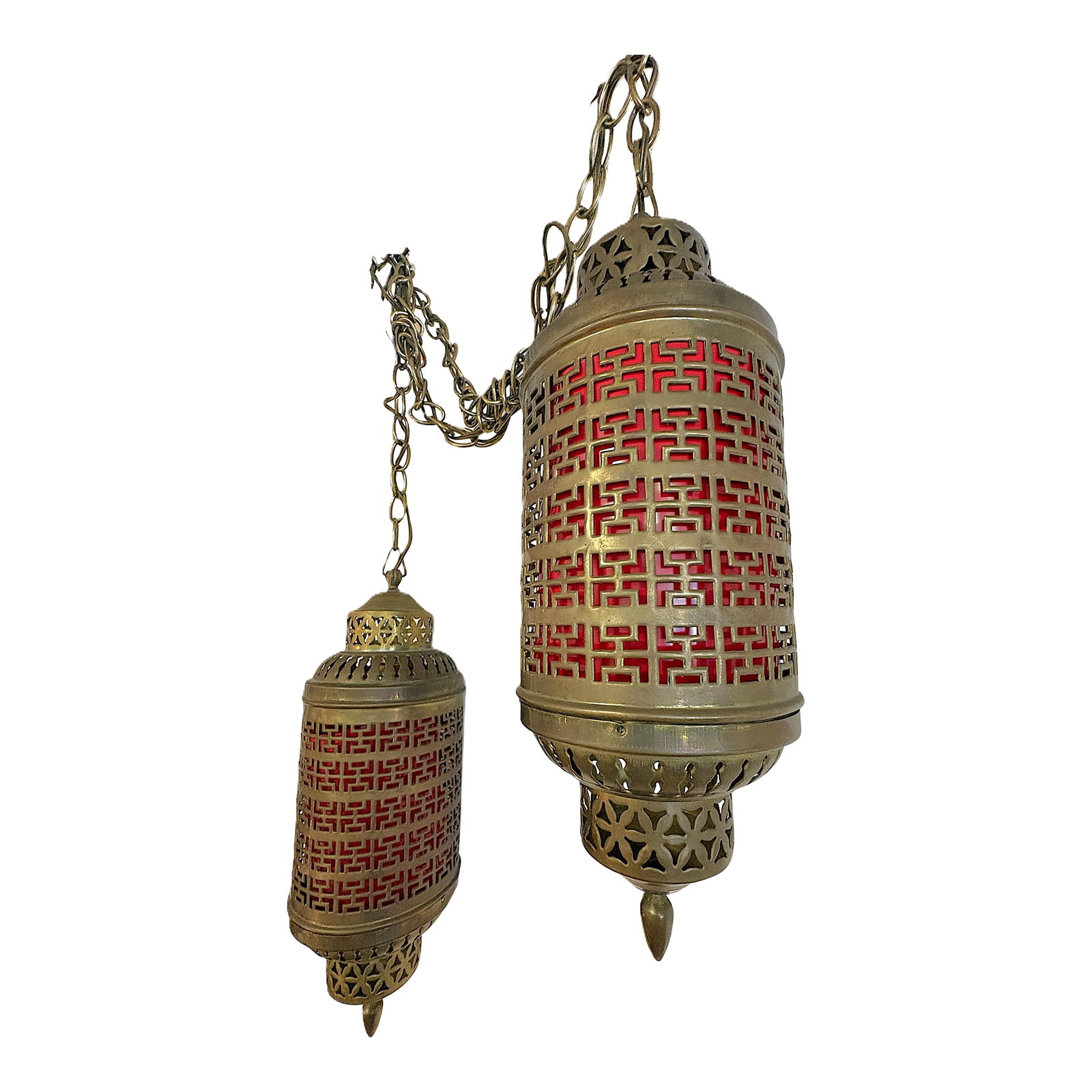 1900's Middle Eastern Hammered & Pierced Brass Swag Electrified Lanterns With Red Liner- A Pair: Classic pair of Middle Eastern style lanterns from the mid 20th century. They are made of hammered and pierced brass with a mid-century geometric pattern that would blend with many interior design