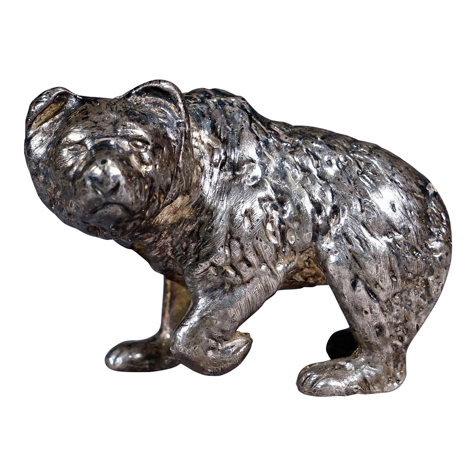 Vintage Silverplated Cast of a Strolling Bear: Vintage Silverplated Cast of a Strolling Bear Item e7244 A lovely sculpture of a strolling bear made of silver plated metal cast, Germany 1st half of the 20th century. 83,3 gramm, 2.93 oz. A
