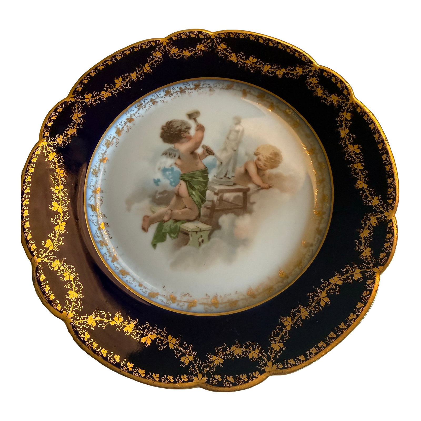 Antique Wm. Guerin Limoges Cobalt & Gilt Hand-Painted Cherub Cabinet Plates – Pair: handsome pair of antique French Limoges cabinet plates by Wm. Guerin & Co., dating to the late 19th/early 20th century. Each plate showcases a beautifully rendered central scene of winged cherubs (put
