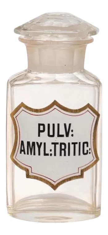 1840s French Louis-Philippe Period Glass Apothecary Jar with Latin Label: French glass apothecary lidded jar from the mid-19th century. Created in France under the reign of king Louis-Philippe, the pharmacy jar (measuring 3.125" W x 3" D x 6.75" H) presents a lid and Latin