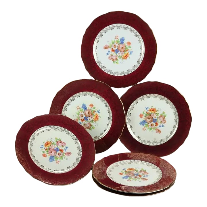 Early 20th Century Atlas Burgundy & Gilt Rim China Dinner Plates with Floral Well- Set of 6: A set of six dinner plates by Atlas China offer porcelain construction with well having floral bouquet and burgundy rim with foliate and scroll gilt decoration, maker stamp on bases as photographed,