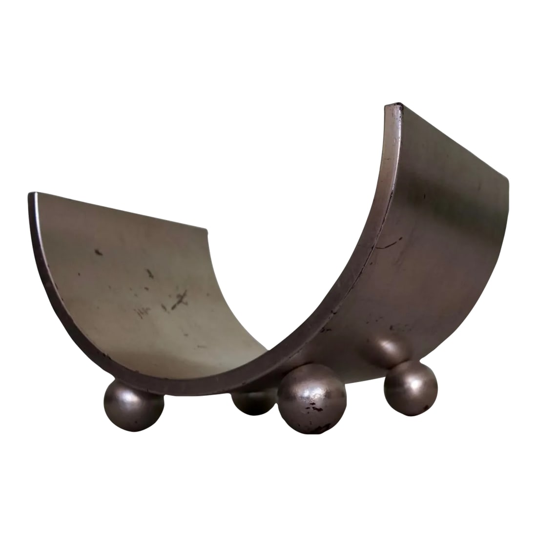 1950's Mid-Century Modern Bentwood Silver Leaf Magazine Rack: Vintage 1950's Mid-century Modern magazine rack for sale. Really solid and well made. Silver leaf. Shows vintage patina as shown. Great silver finish. Has four ball legs. Bentwood curved Art Deco desi