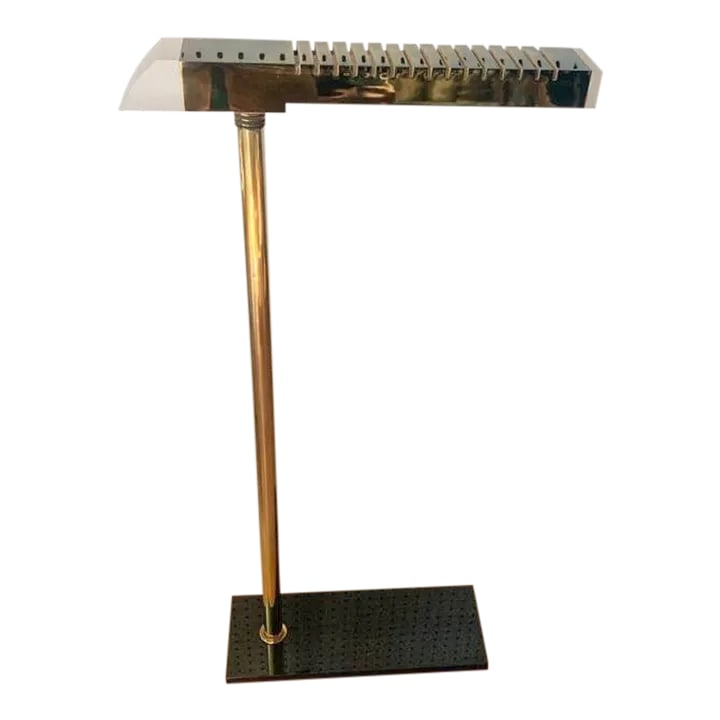 Brass and Lucite Floor Lamp: Wonderful postmodern style Artemide floor lamp, made in Italy. Constructed with brass and lucite. Swivels at the top 360*. In working condition (includes bulb). Measures 40" high. Top is 19.5" wide