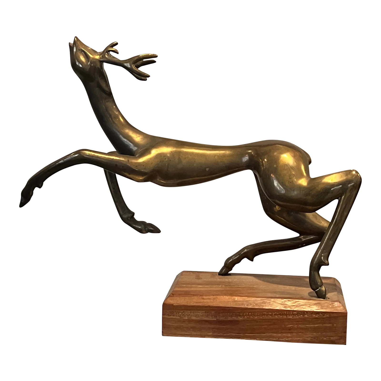 Mid-Century Brass Leaping Deer Sculpture on Wooden Base: Mid-Century Brass Leaping Deer Sculpture on Wooden Base This elegant mid-century sculpture captures the fluid motion of a leaping deer, crafted in polished brass with finely detailed features. The dyn