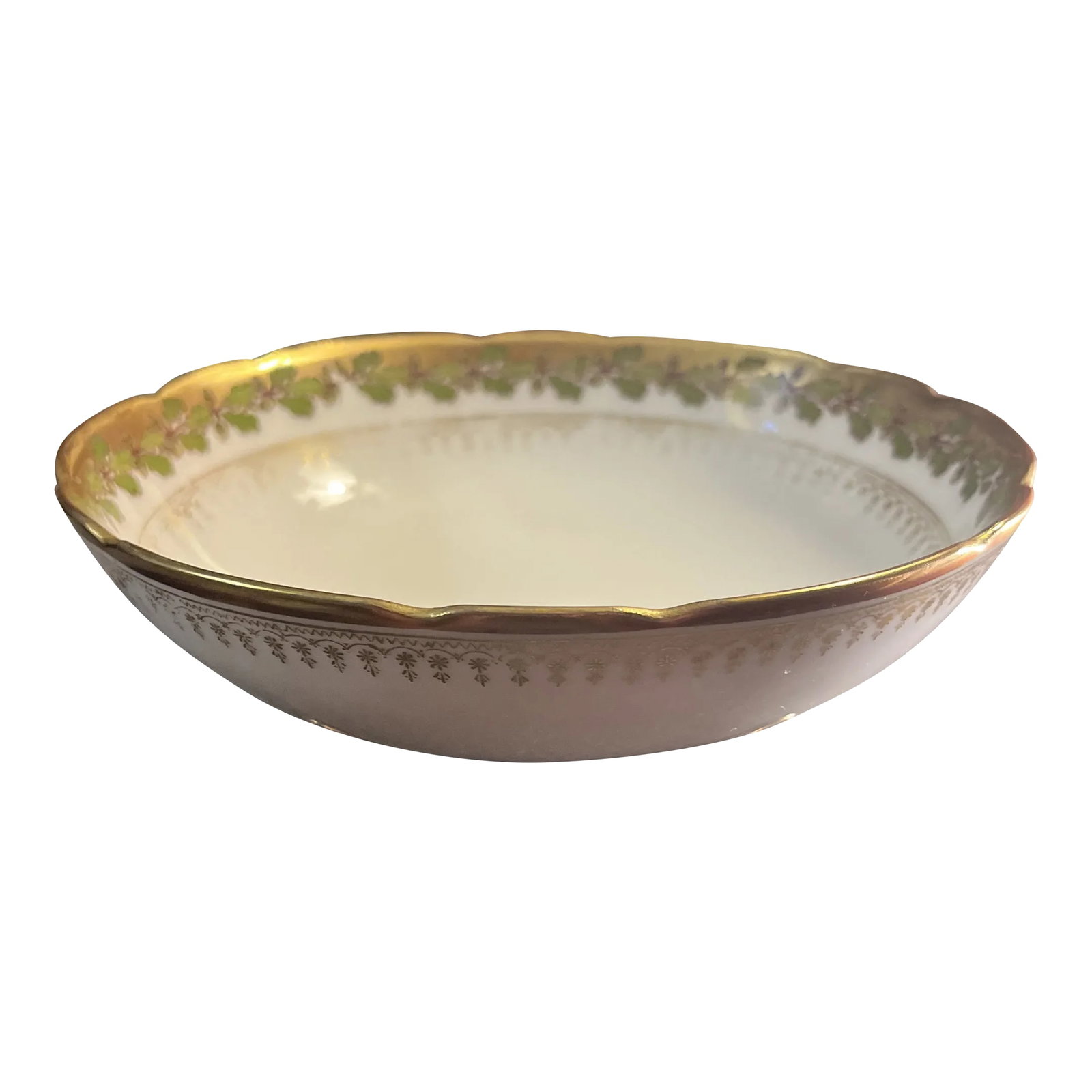 Antique B&h Limoges Footed Bowl: Footed bowl by Blakeman & Henderson (B&H) for Limoges (France). White bowl with green ivy type motif along interior edge accented in gold. Scalloped edge along top of bowl with gold border design on