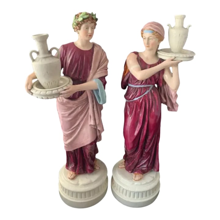 20 In. Tall Antique Bohemian Porcelain Sculptures- Water Jug Carriers - a Pair: This breathtaking pair of Antique Czech Bohemian Royal Dux Style Porcelain Water Jug Carrier Sculptures stand at an impressive 20 inches tall. The male figure, stands atop a pedestal, draped in a wine