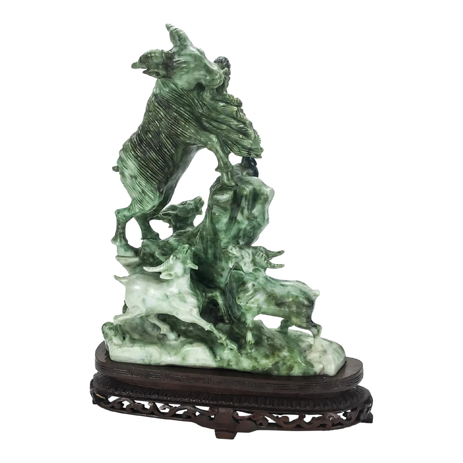Vintage Chinese Stone Carving on Rosewood Stand: Beautiful detailing on this wonderful carved goats statue. The material is the color of Jade, however I am very sure that it's not actually Jade. It is probably Jadite. I purchased in Hong Kong in the