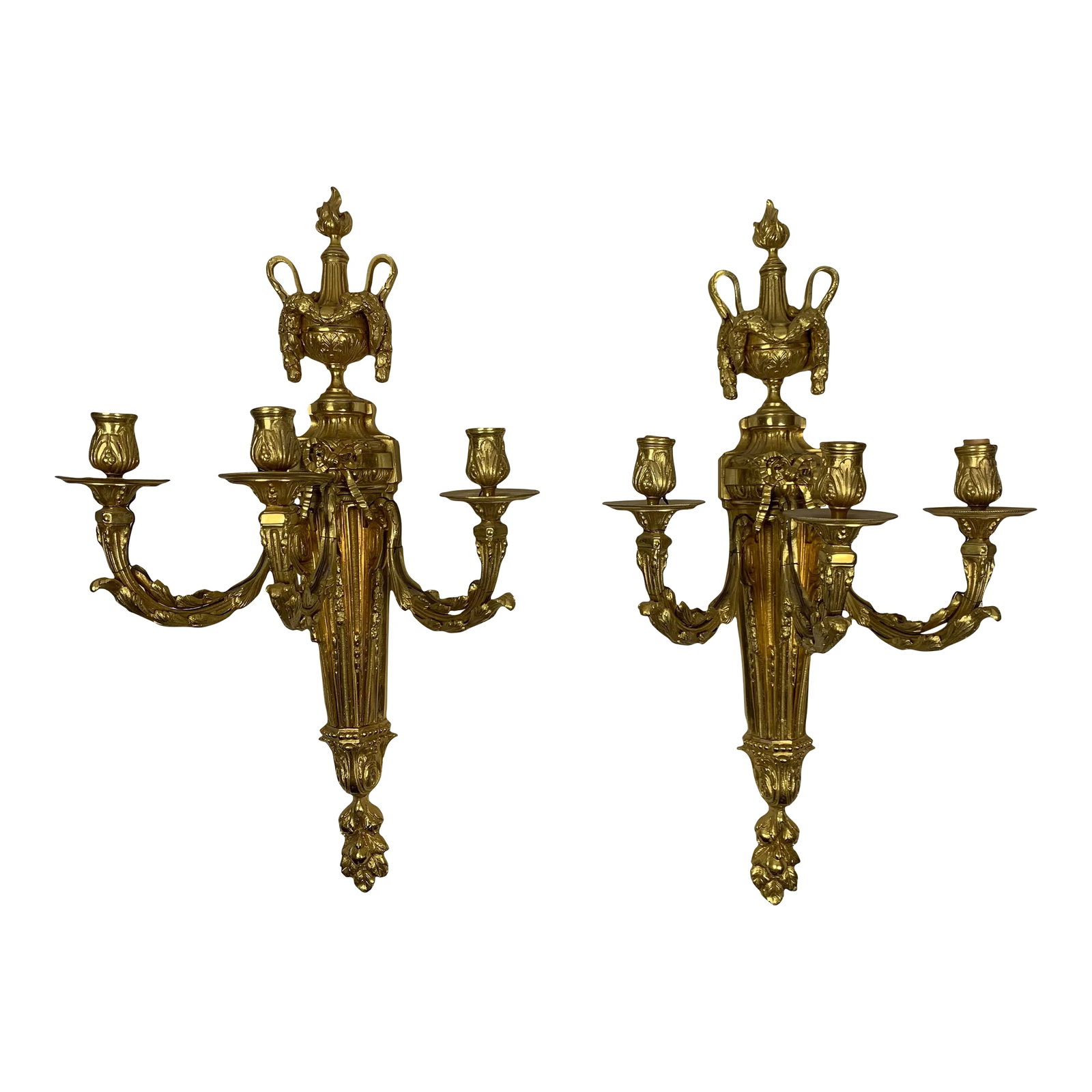 19th Century Neoclassical Style Gilt Bronze Sconces - a Pair: Set of Two 3-Candle 19th Century Wall Sconces. Each with a classical vase pediment, draped with gathered laurel leaves and berries, standing on a leaf adorned spreading plinth. The tapering bodies wit