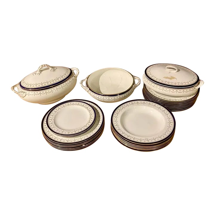 Antique China Service by Cauldon, Staffordshire England- 26 Pieces: Elegant china service by Cauldon, pattern number 7477, made for James Green, a London retailer. There is a slight variation of the shade of navy blue on all pieces. To Include: 1-soup tureen, 8"T x