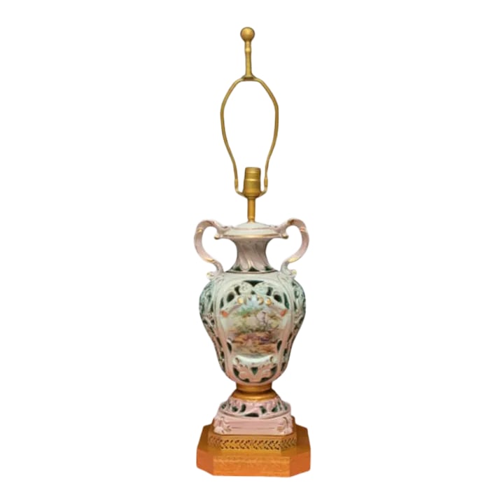 Mid-Century Capodimonte Porcelain Table Lamp- Courting Couple Pastoral Scene: This stunning mid-century Capodimonte porcelain table lamp is a true testament to Italian craftsmanship, showcasing a harmonious blend of artistry and elegance. On one side, the lamp features a captiv