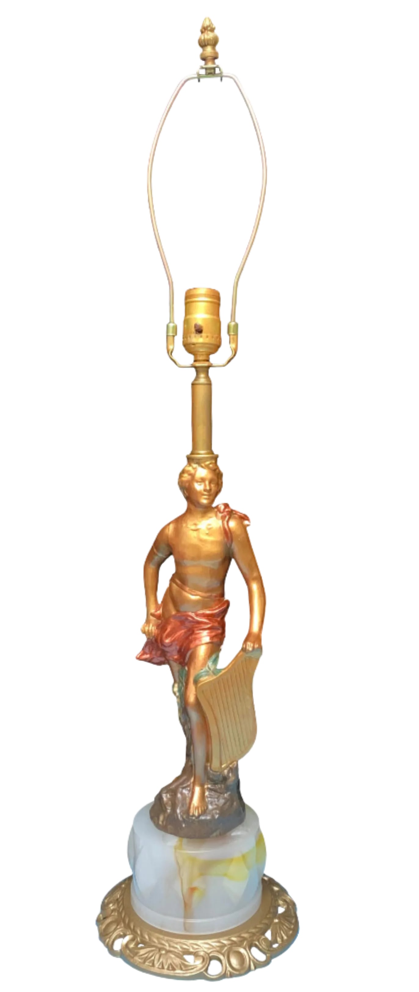 Vintage Sculptural Table Lamp: Apollo Holding a Lyre: This exquisite sculptural lamp masterfully embodies the youthful essence of Apollo, the Greek god of music, poetry, and light. Gracefully poised upon a rock and surrounded by lush foliage, Apollo's le