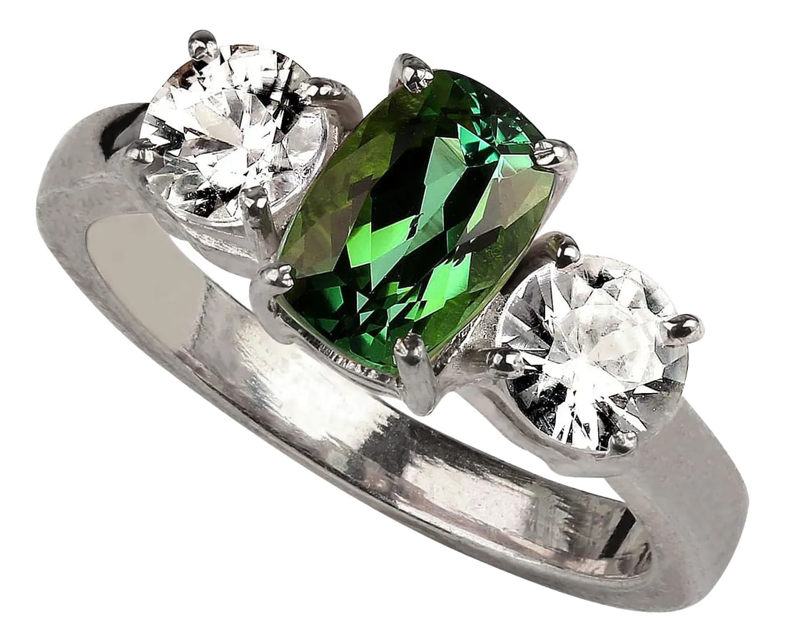 Oval Green Tourmaline Accented With Scintillating Real Zircons: This stunning ring features a vibrant 1.68-carat Brazilian oval green Tourmaline, beautifully complemented by two round genuine Zircons, totaling 1.44 carats. The combination of the rich green Tourmal
