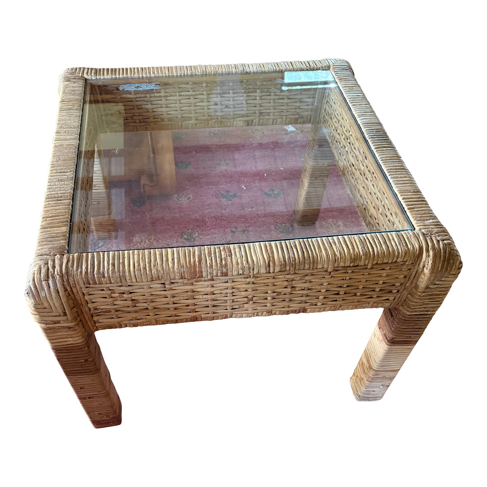 Chic Coastal Rattan Glass Top Square Table: Coastal chic modern square coffee table is wrapped in solid rattan with a beautiful glass top waiting for your coffee cup and cat to curl up on. Condition: Alterations: Original Condition Unaltered Im