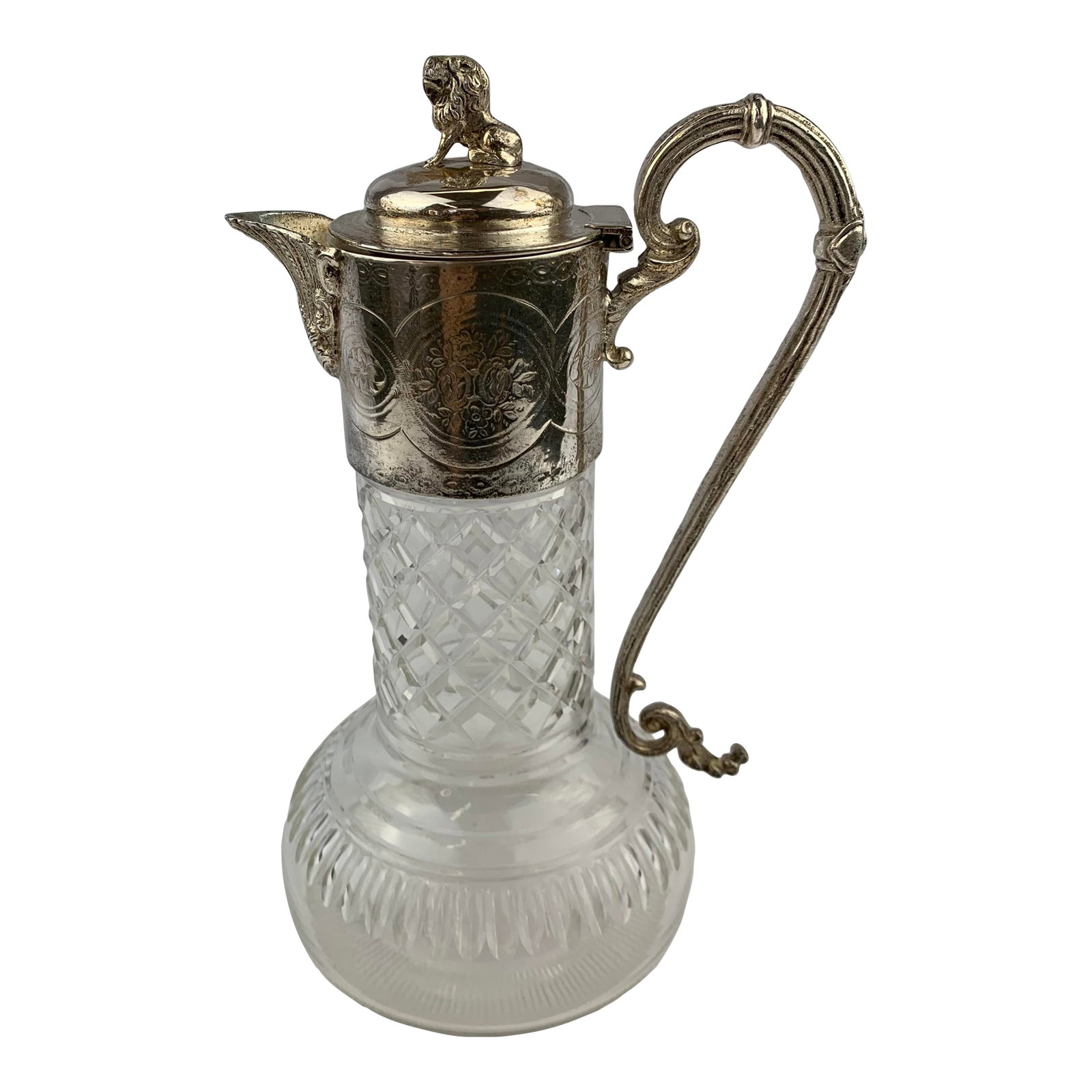 1950s Silverplate Etched Crystal Water Pitcher: 1950s Silverplate Etched Crystal Water Pitcher with ornate handle design and small seated lion servicing as the lid handle. From B.D Howles and Son. Condition: Alterations: Original Condition