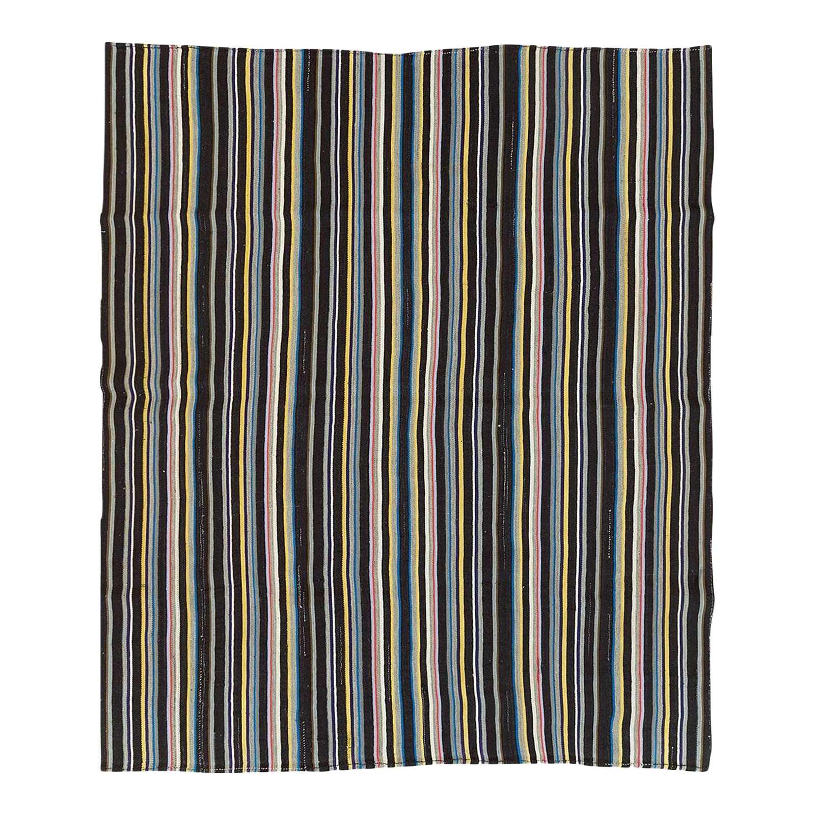 Galerie Shabab Collection Mid-20th Century Turkish Flatweave Kilim Room Size Carpet: A vintage Turkish flatweave Kilim room size carpet handmade during the mid-20th century with a vertically striped multicolored pattern including shades of black, red, blue, and yellow. Measures: 9' 7"