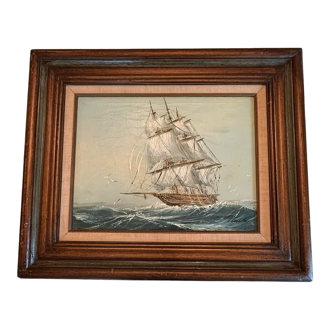 Mid 20th Century Framed Oil on Canvas Painting "Clipper Ship at Sea" Artist Signed Paolo: This signed mid 20th century oil painting depicts a three"‘masted clipper with seagulls. The canvas is in very good preloved condition. The original dark layered wood frame shows light scuffs th